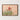 Sturt’s Desert Pea photography print with red flowers against soft sandy tones, shown edge-to-edge in a solid walnut timber frame.