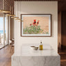 Sturt’s Desert Pea artwork in a walnut frame with a white border, displayed above a marble kitchen island.